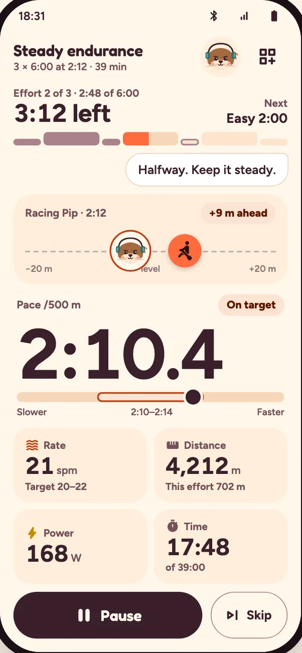 Live row with Pip: racing Pip 9 m ahead, pace 2:10.4, on target. Pip says: “Halfway. Keep it steady.”